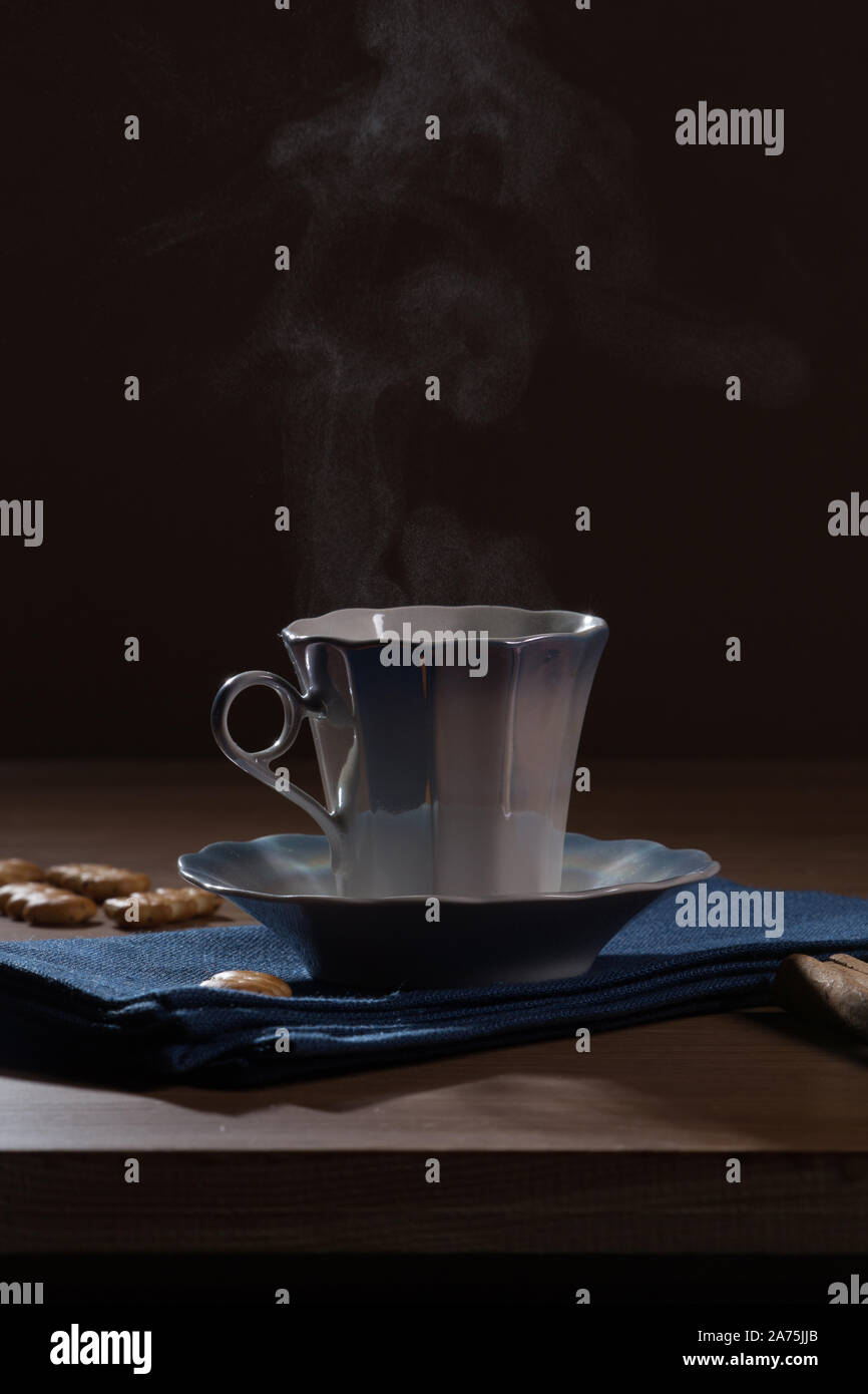 cup of hot coffee, from which steam rises Stock Photo