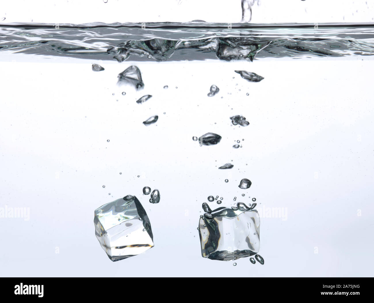Ice cubes falling into the water Stock Photo - Alamy