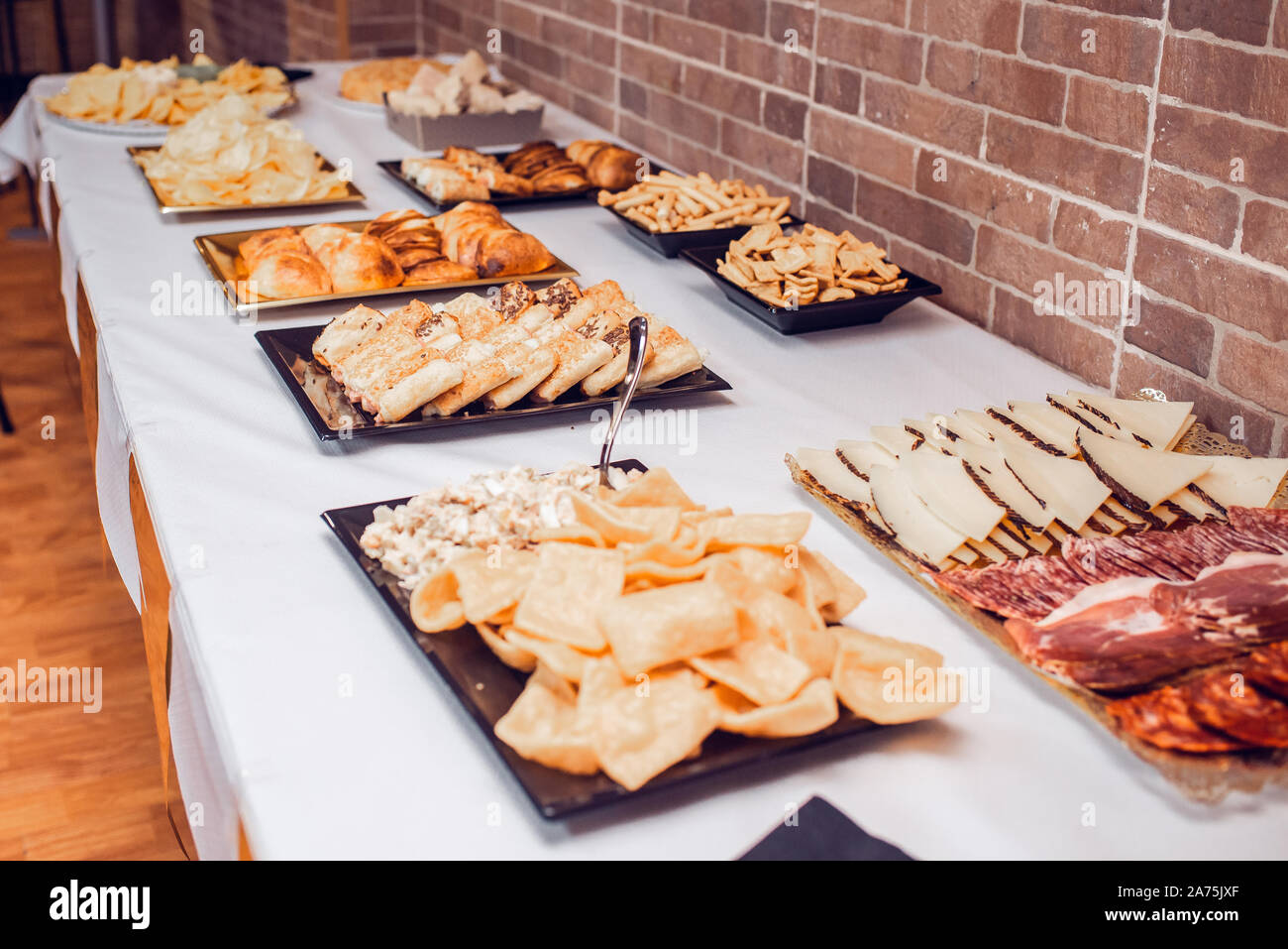 Grilled corn and baked potatoes stuffed with cheese in hotel pan on food  warmer. Self-service buffet table. Celebration, party, birthday or wedding  Stock Photo - Alamy