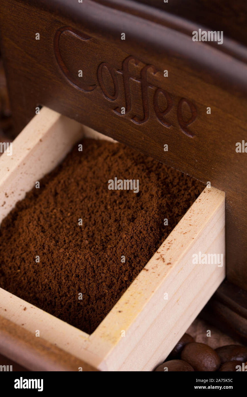 Ground coffee in a box of old coffee grinders Stock Photo Alamy