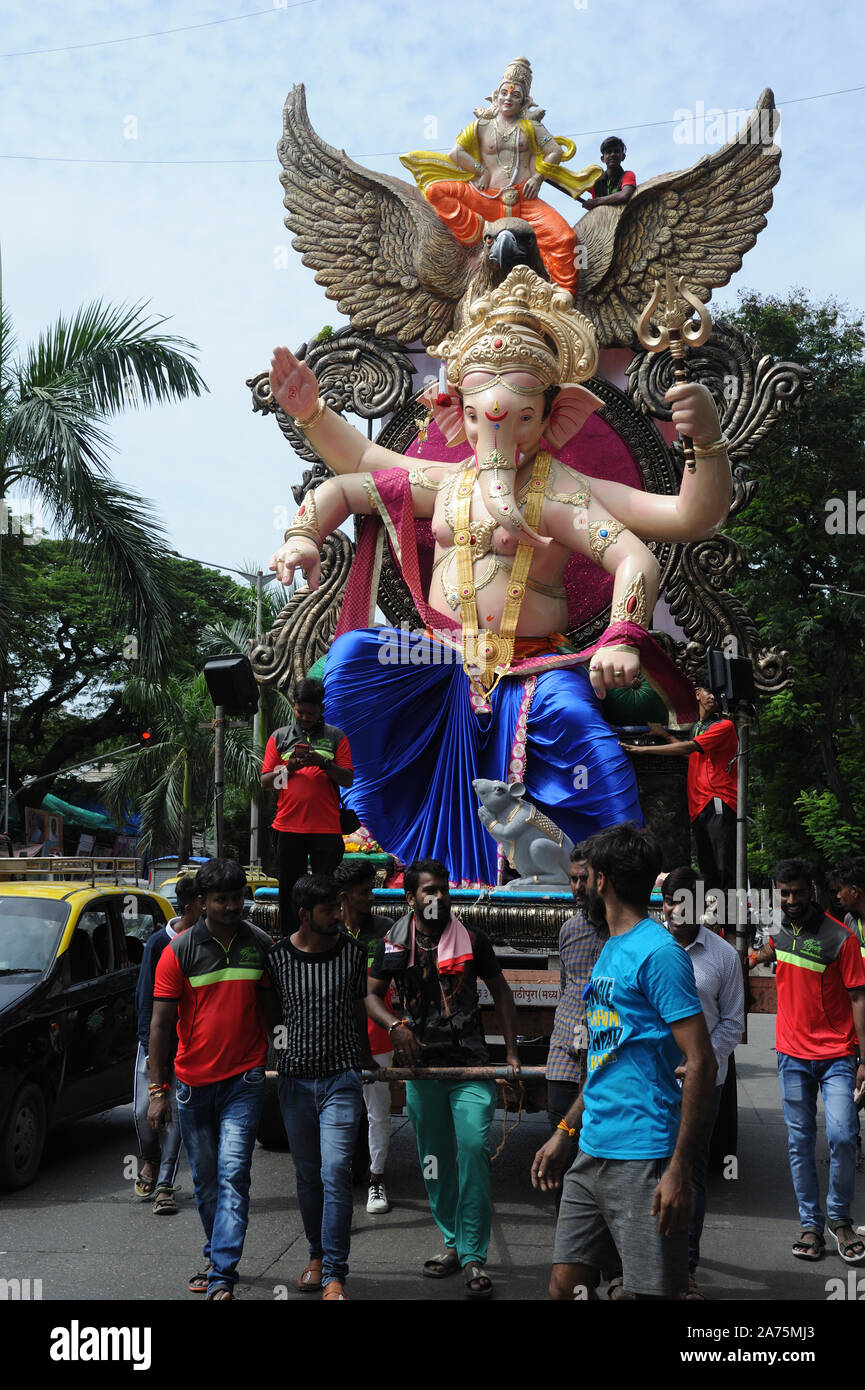 Mumbai, Maharashtra, India,  Asia - Procession Huge idols of lord Ganesh elephant-headed Hindu God Ganesha Transported by cart for Ganpati festival Stock Photo
