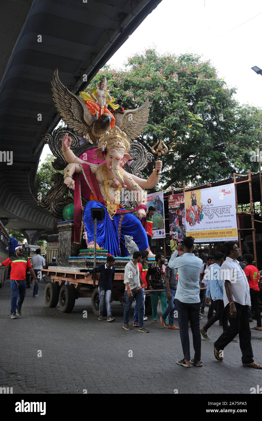 Mumbai, Maharashtra, India,  Asia - Procession Huge idols of lord Ganesh elephant-headed Hindu God Ganesha Transported by cart for Ganpati festival Stock Photo