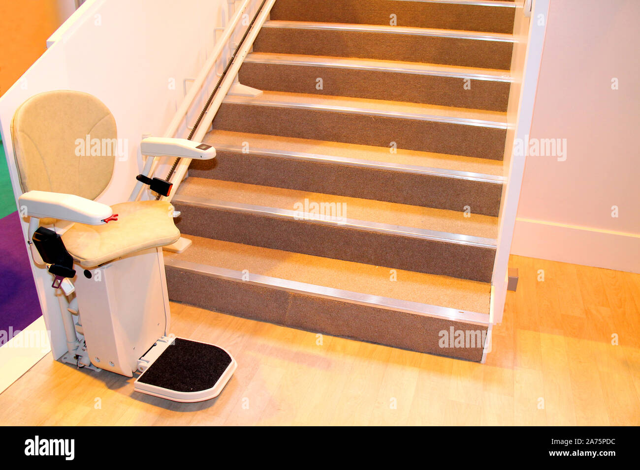 An Electric Powered Assistance Stair Lift with Seat Stock Photo Alamy