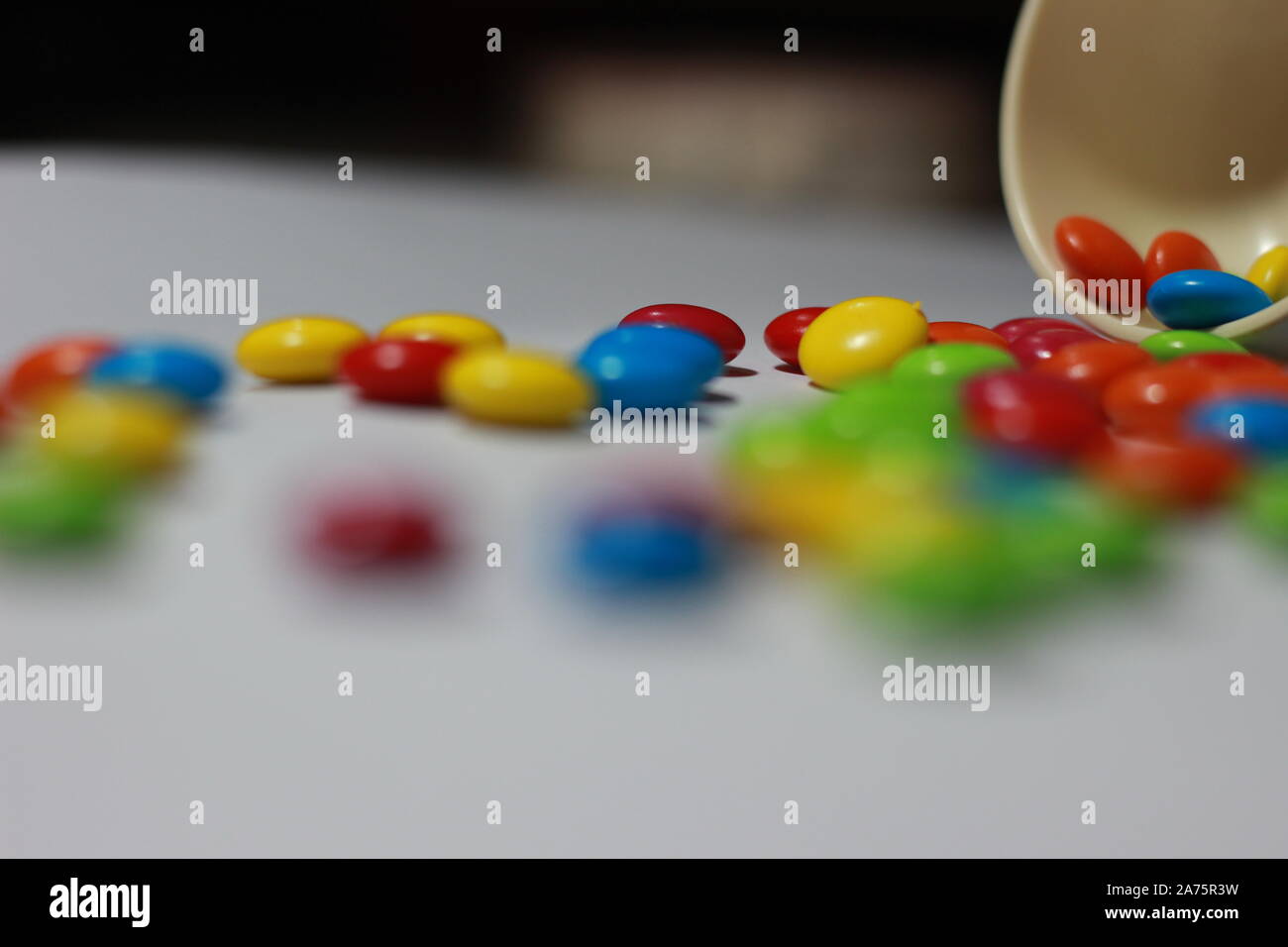 Sugar Coated Chocolate Gems Candy Stock Photo - Alamy