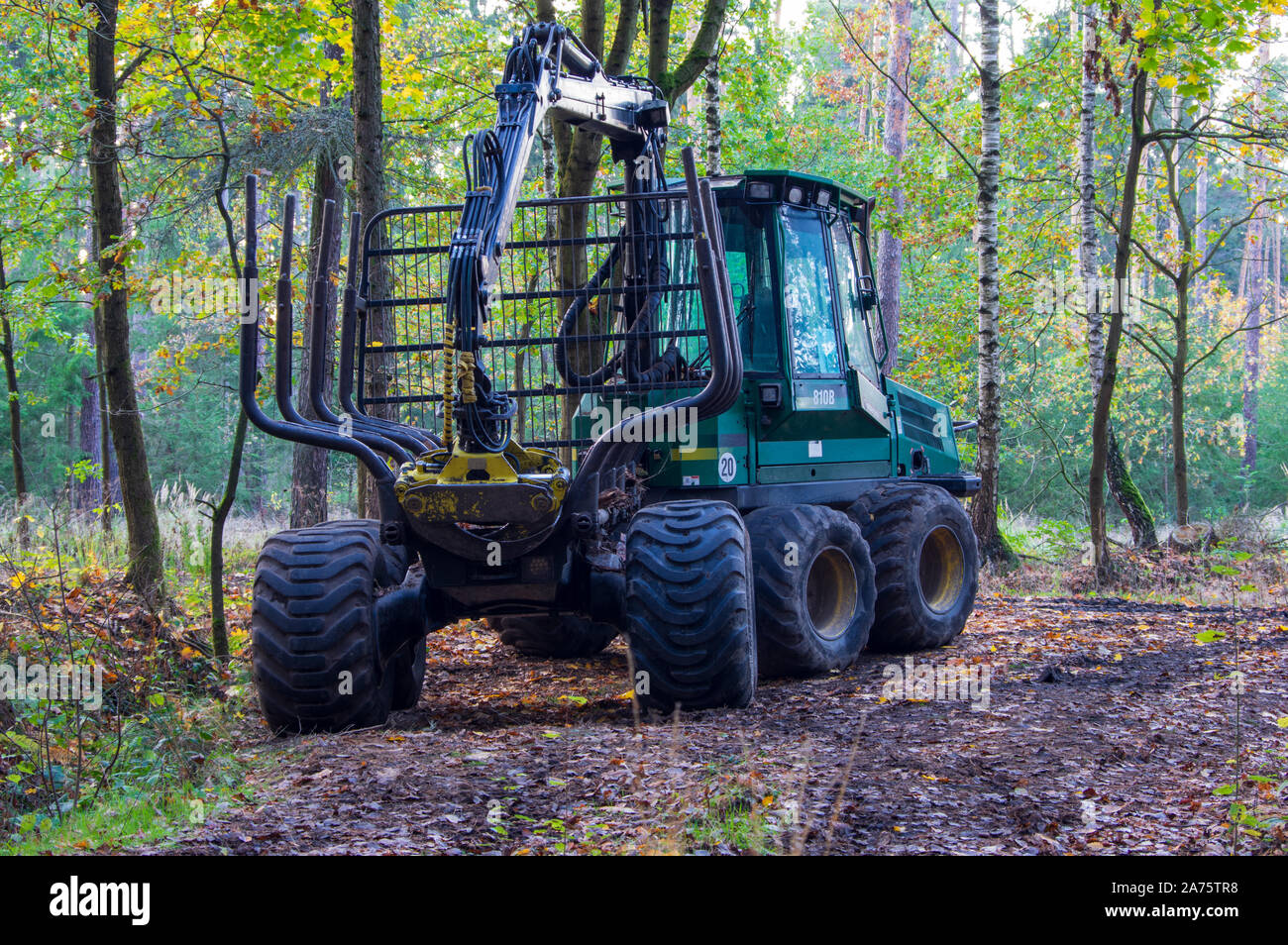 parked John Deere Timberjack 810B in forest in Saxony Germany Stock Photo