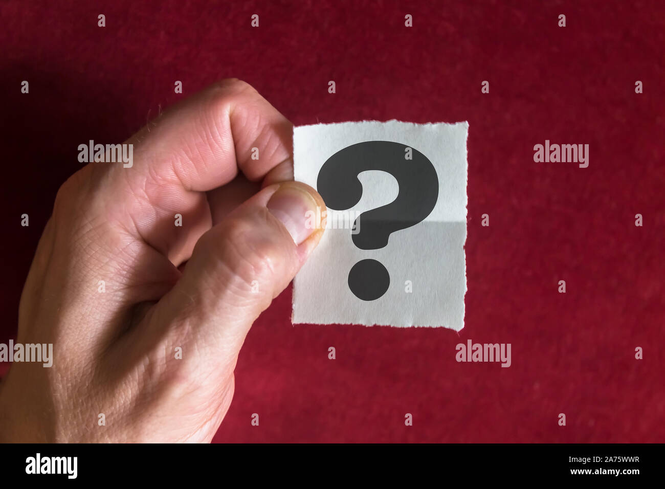 Black Question Mark Printed on an Paper Note Stock Photo