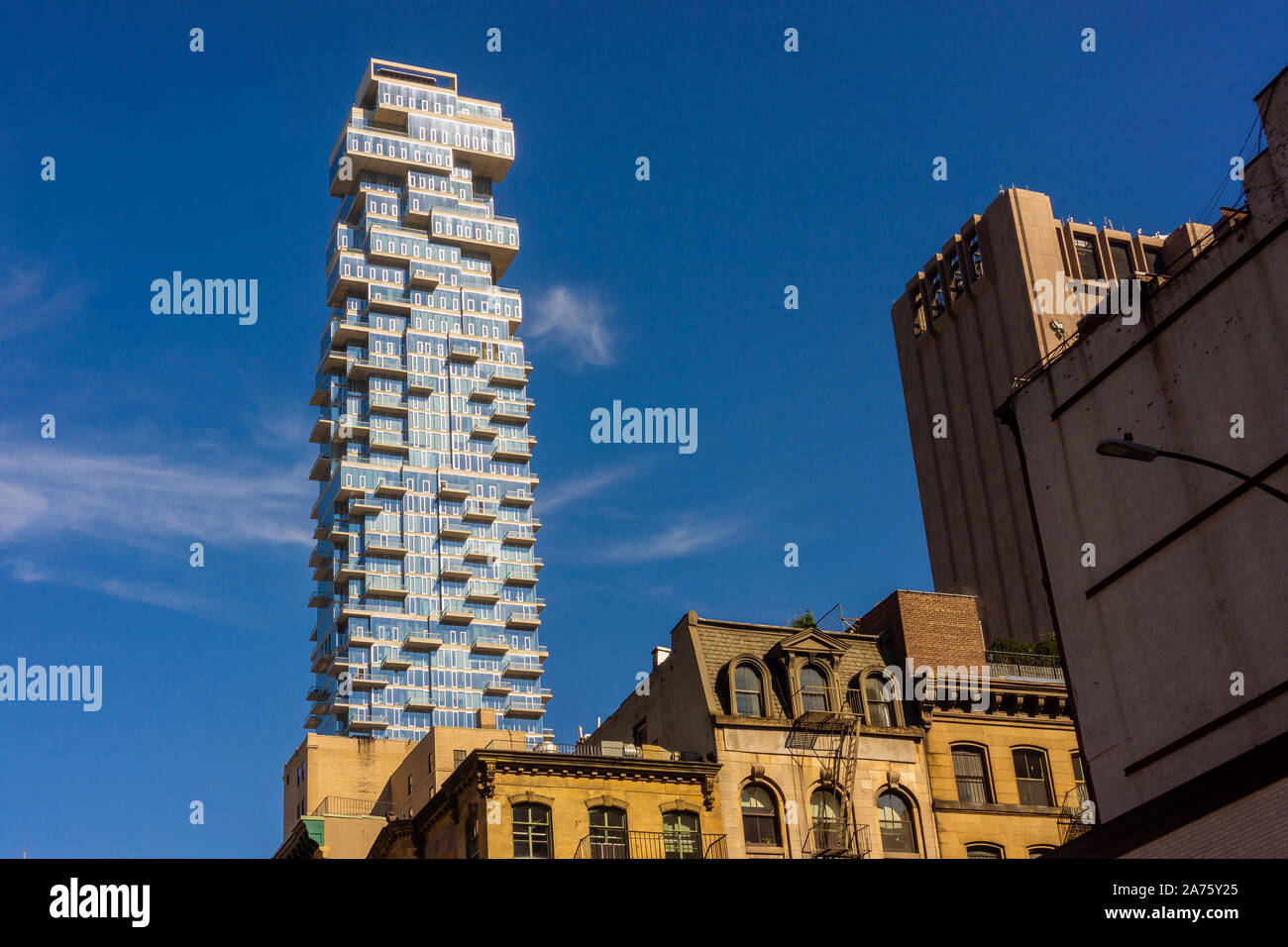 The condo skyscraper at 56 Leonard Street looms over lower Tribeca buildings in New York on Saturday, October 19, 2019. 56 Leonard Street, designed by Herzog & de Meuron is 820 feet high with 145 apartments. (© Richard B. Levine) Stock Photo