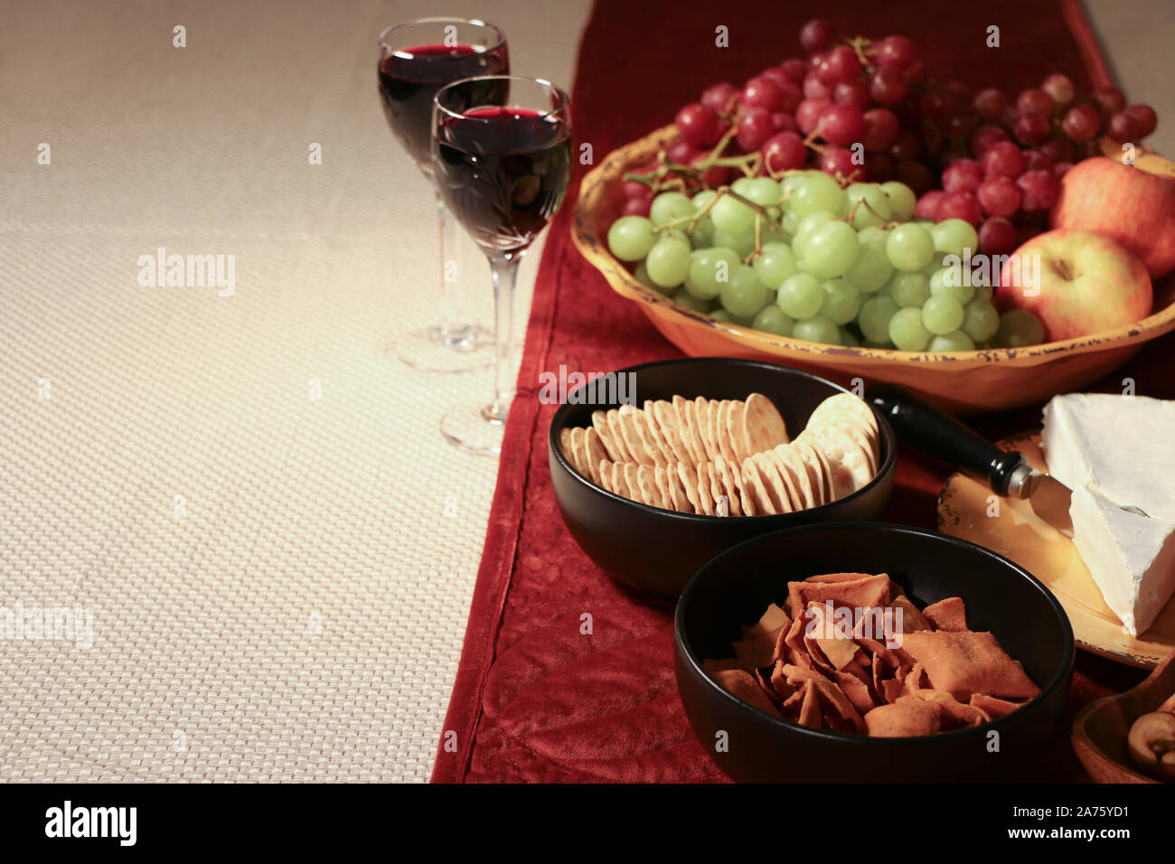 Wine and Cheese Appetizer with Organic Grapes and Crackers Stock Photo