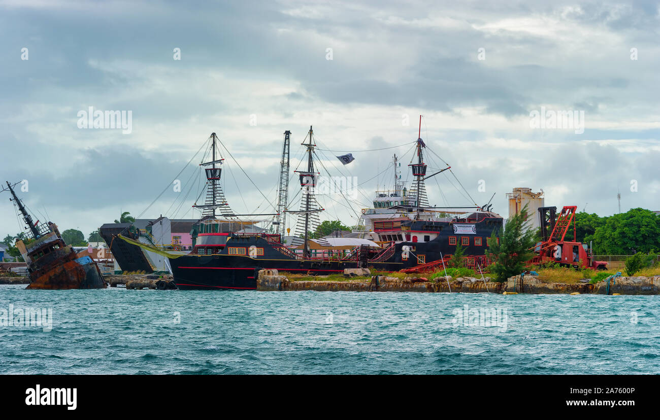 Nassau, Bahama - September 21,2019:  Old Schooners decked out like pirate ships draw tourist near Prince George Wharf on New Providence Island. Stock Photo