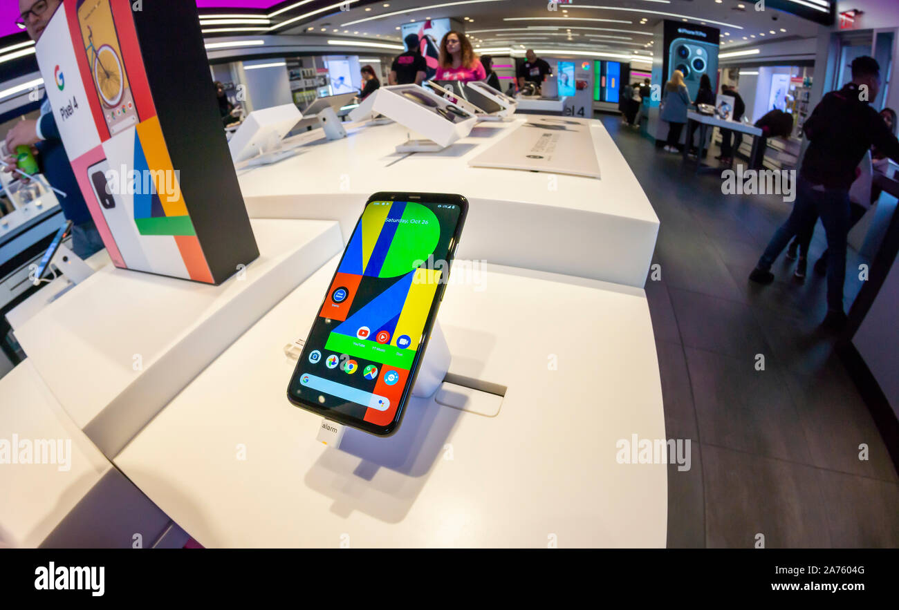 A shopper examines Google’s Pixel 4 smartphone in a T-Mobile store in New York on Saturday, October 26, 2019. (© Richard B. Levine) Stock Photo