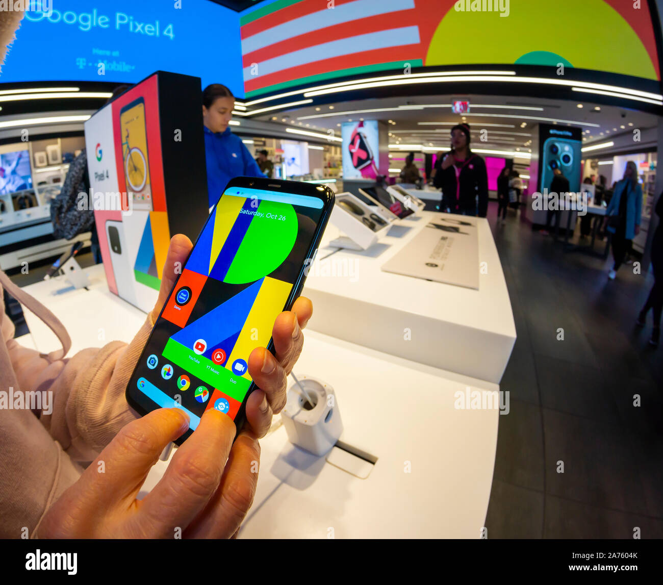A shopper examines Google’s Pixel 4 smartphone in a T-Mobile store in New York on Saturday, October 26, 2019. (© Richard B. Levine) Stock Photo