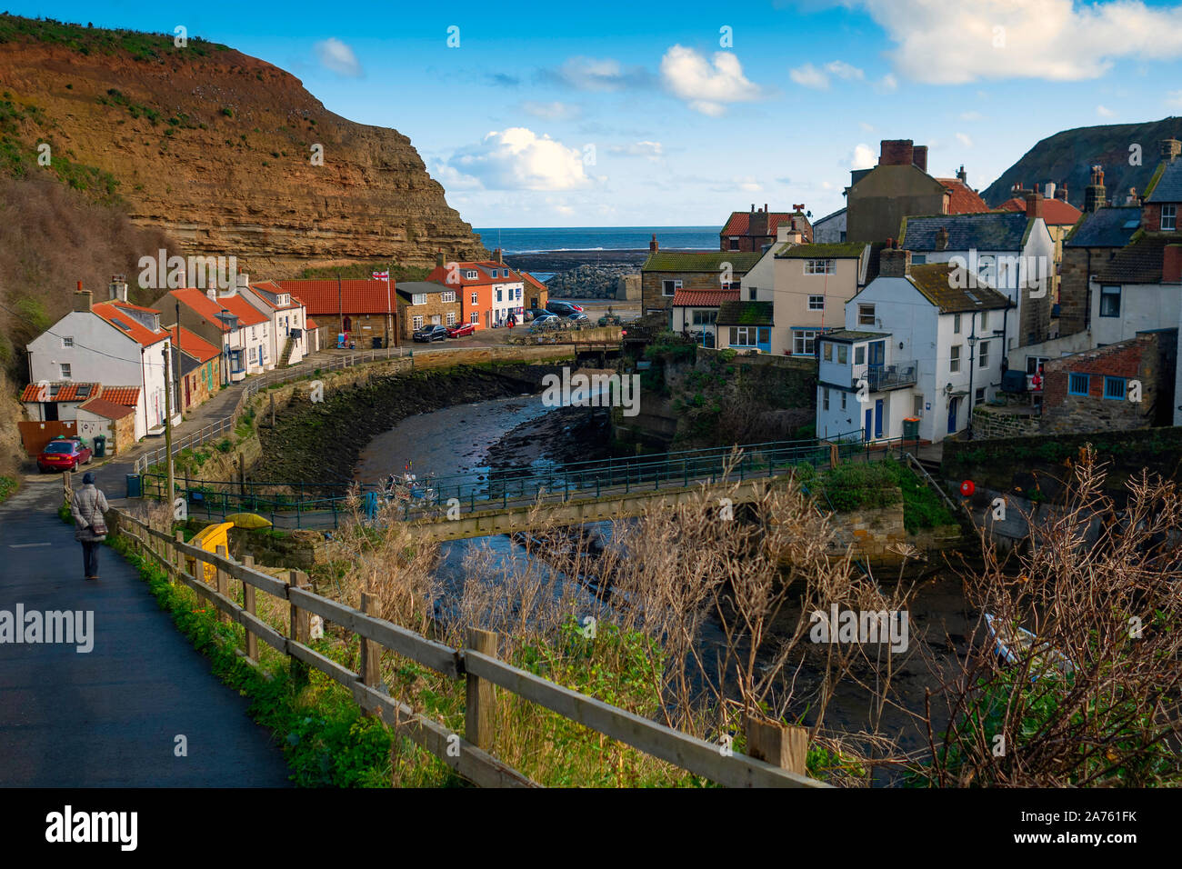 The view looking seawards over the harbour of the North Yorkshire Village of Staithes with Cowbar on the North side of Roxby Beck Stock Photo