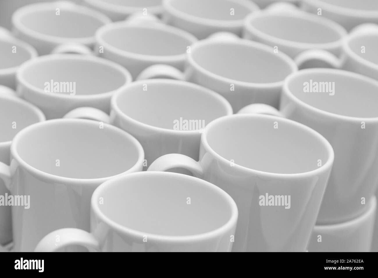 White caramic mugs pattern, close-up view Stock Photo