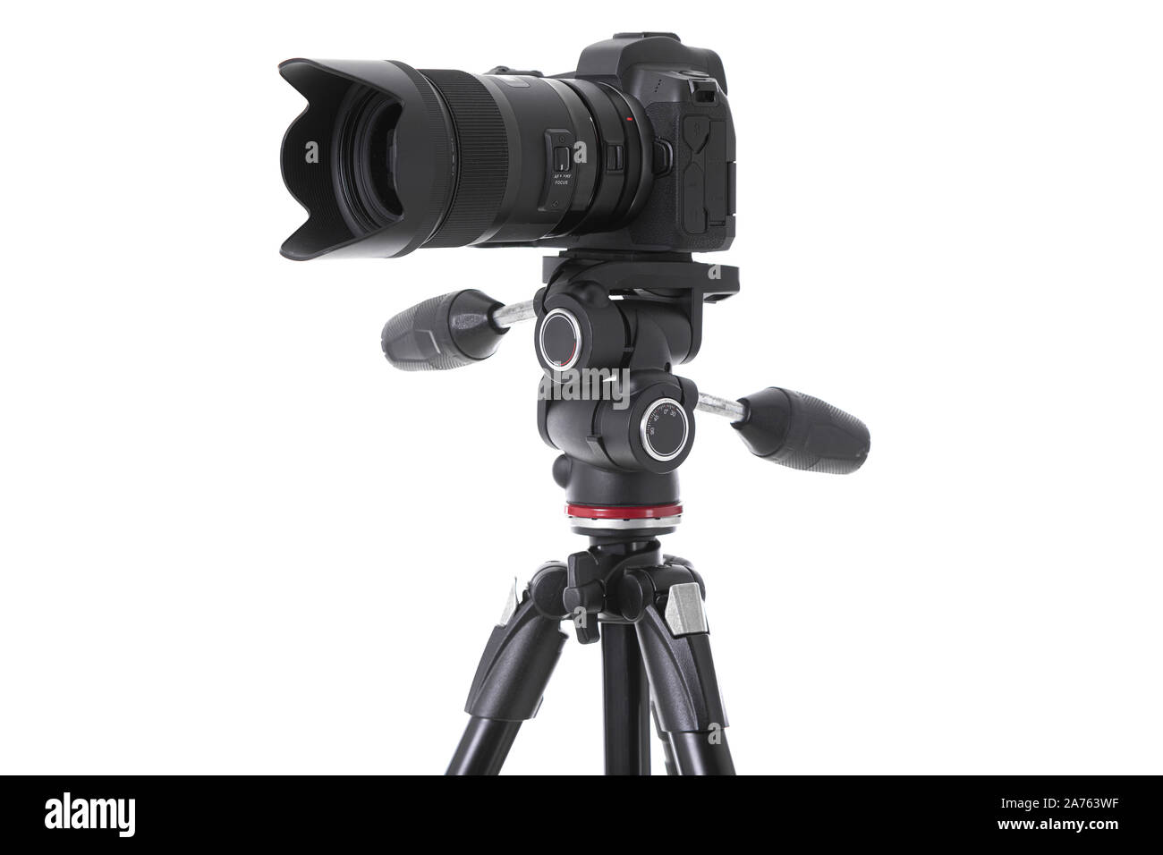 Sideview of professional camera with big camera lens isolated. Photo with depth of field Stock