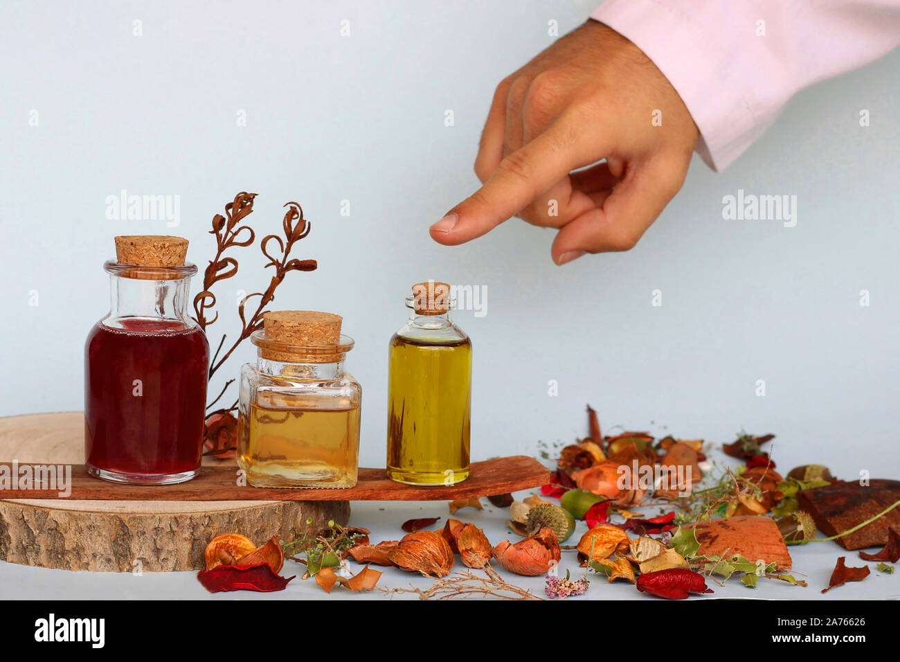 Natural Medicine: Doctor pointing out and recommending the use and consumption of essential oil. Alternative Medicine and Herbal. Stock Photo