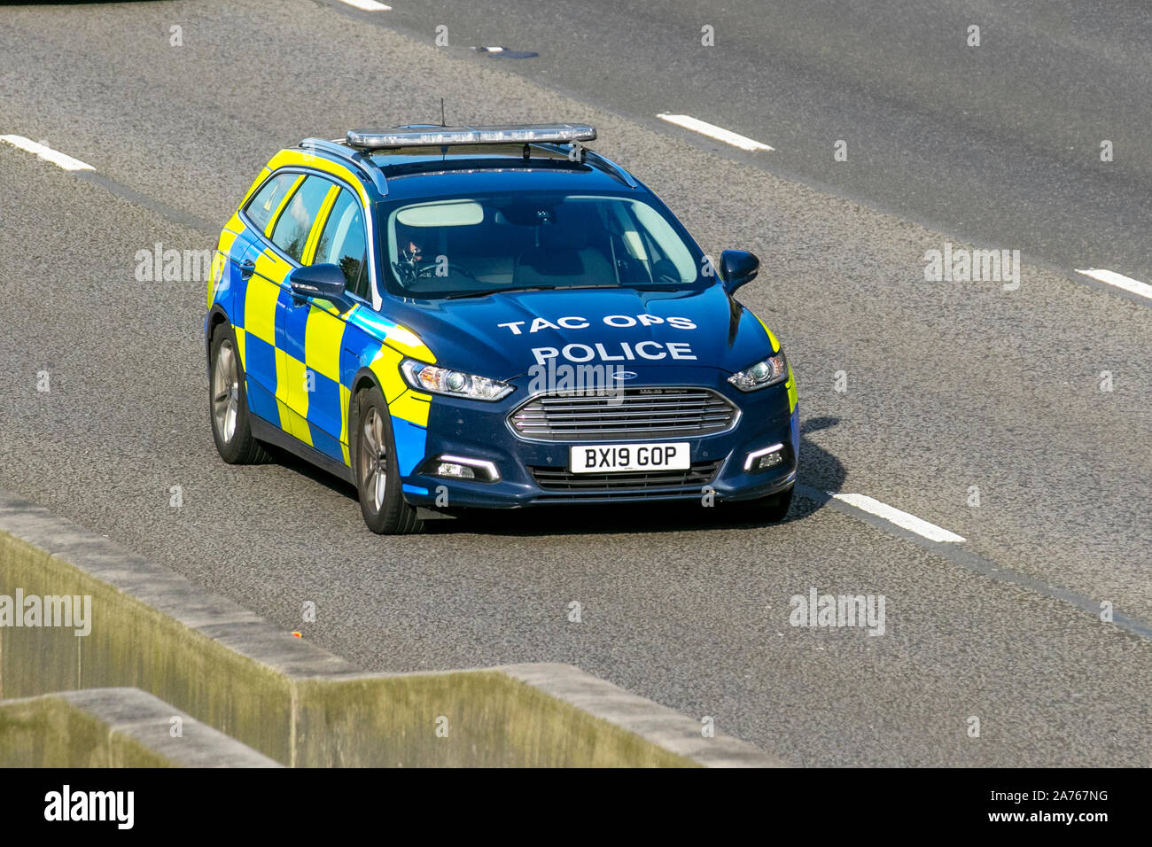 Ford Mondeo Zetec Edition TDCI Police Emergency vehicle; UK Vehicular traffic, transport, modern vehicles, saloon cars, south-bound on the 3 lane M6 motorway highway. Stock Photo