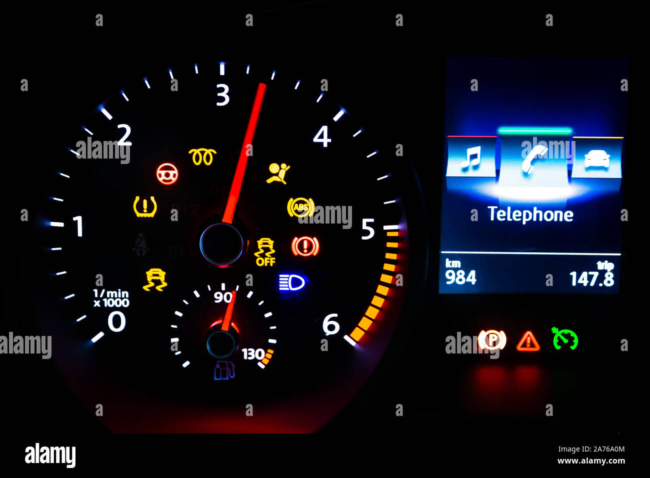 Modern light car mileage (dashboard, milage) isolated on a black background. New display of a modern car. Telephone. Stock Photo