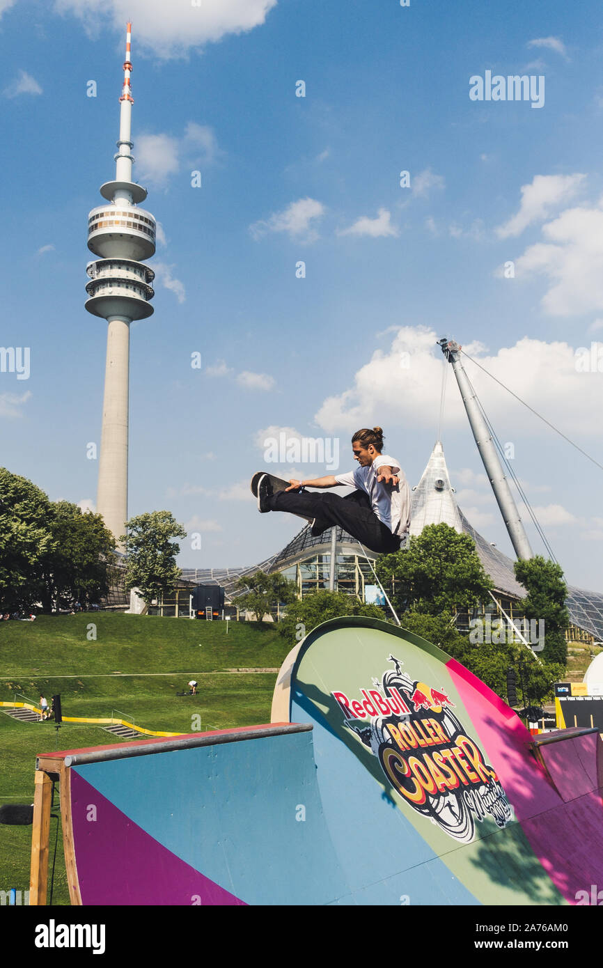 Professional Skateboarder doing tricks in Olympic Park in Munich Germany Stock Photo