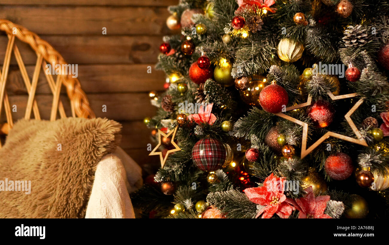 Happy Holiday. A beautiful wooden living room decorated for Christmas. Stock Photo