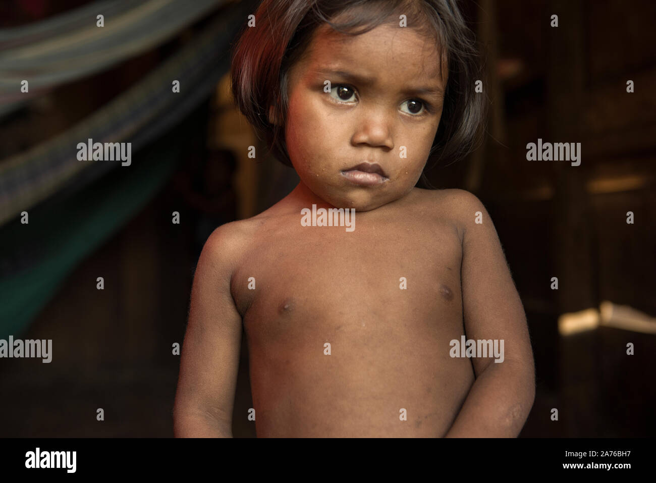 Breves, Para, Brazil - August 04, 2016: Poor Brazilian indigenous girl at home, in the riverside slums of Breves city, Stock Photo