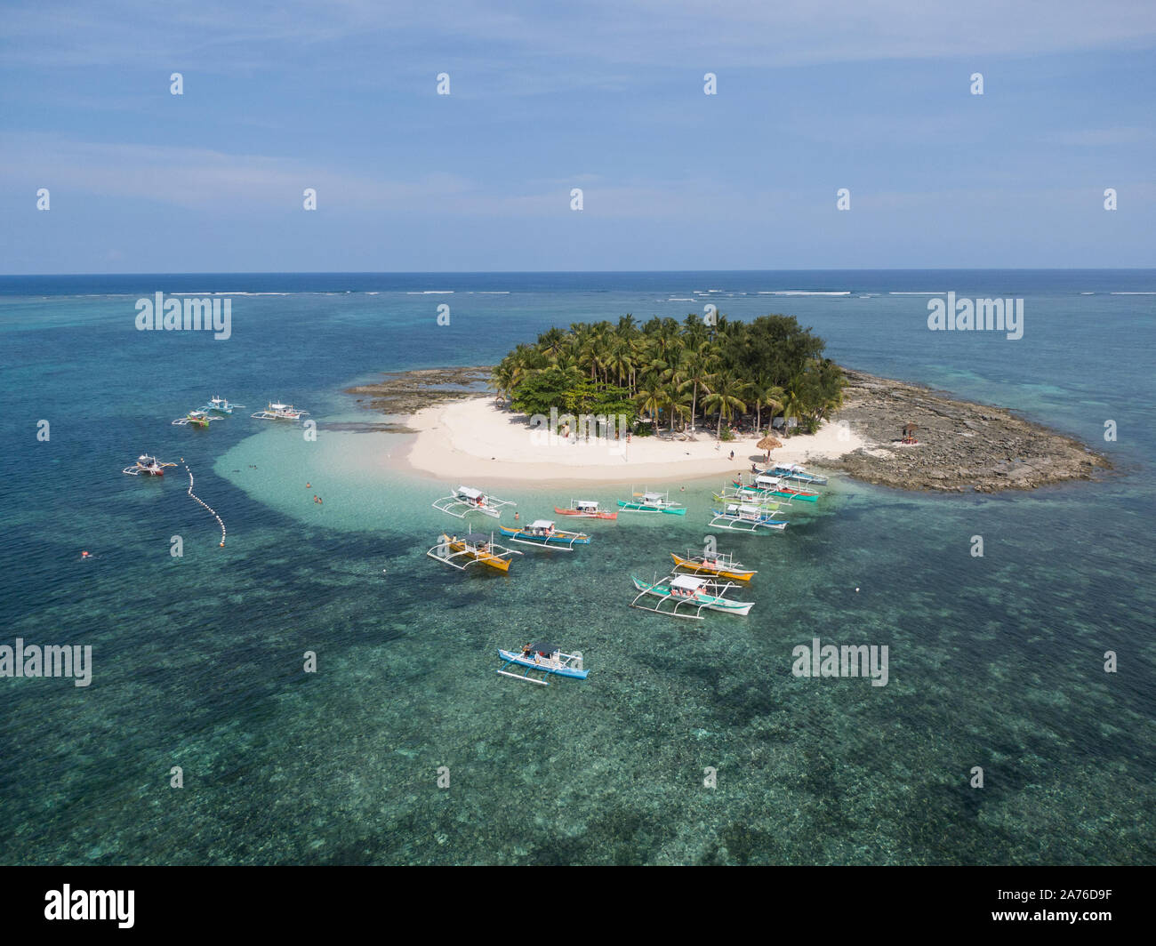 Famous tourism island in Siargao, Surigao del Norte, Philippines, South East Asia; Guyam Island, Palm tree covered sandy beach island in the ocean Stock Photo
