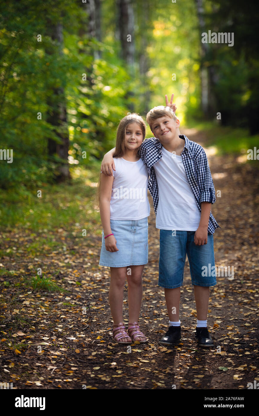 Brother And Sister Play Laugh Fool Around And Make Grimaces And Funny Faces Together Little Boy And Girl Friends Children Kids Smile And Have Stock Photo Alamy