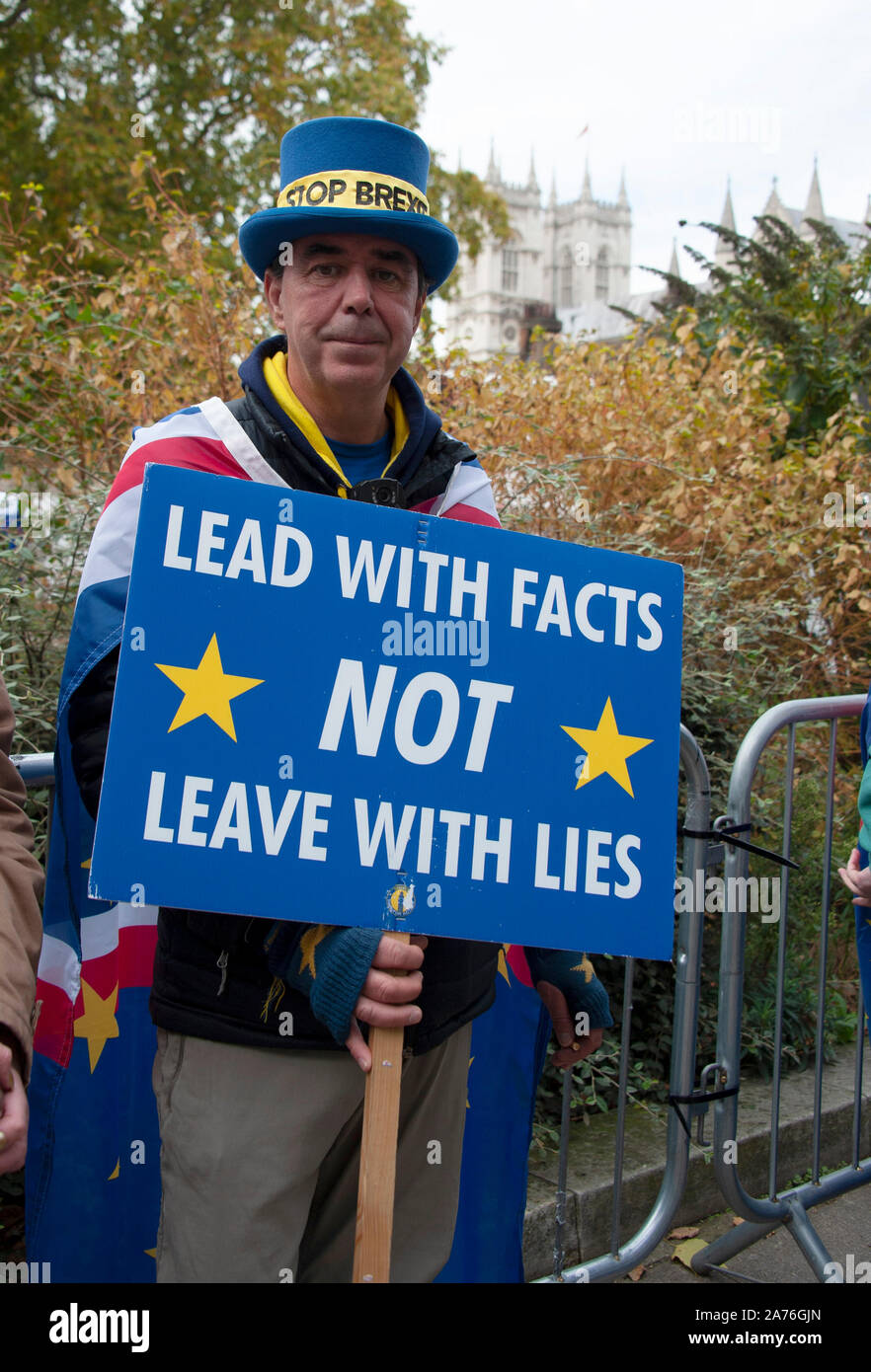 London, Westminster, 28 October 2019: Male Brexit Protestor outside the Houses of Parliament in London- protesting against the UK leaving the EU Stock Photo
