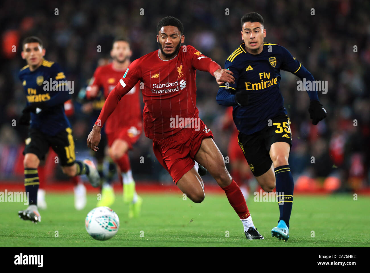 Liverpool's Joe Gomez and Arsenal's Gabriel Martinelli (right) battle for the ball during the Carabao Cup, Fourth Round match at Anfield, Liverpool. Stock Photo