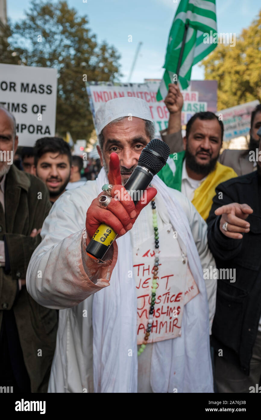 London, UK, 27th Oct 2019. Protestors express their anger by kicking and punching an effigy of Narandra Modi, the current Prime Minister of India. Stock Photo