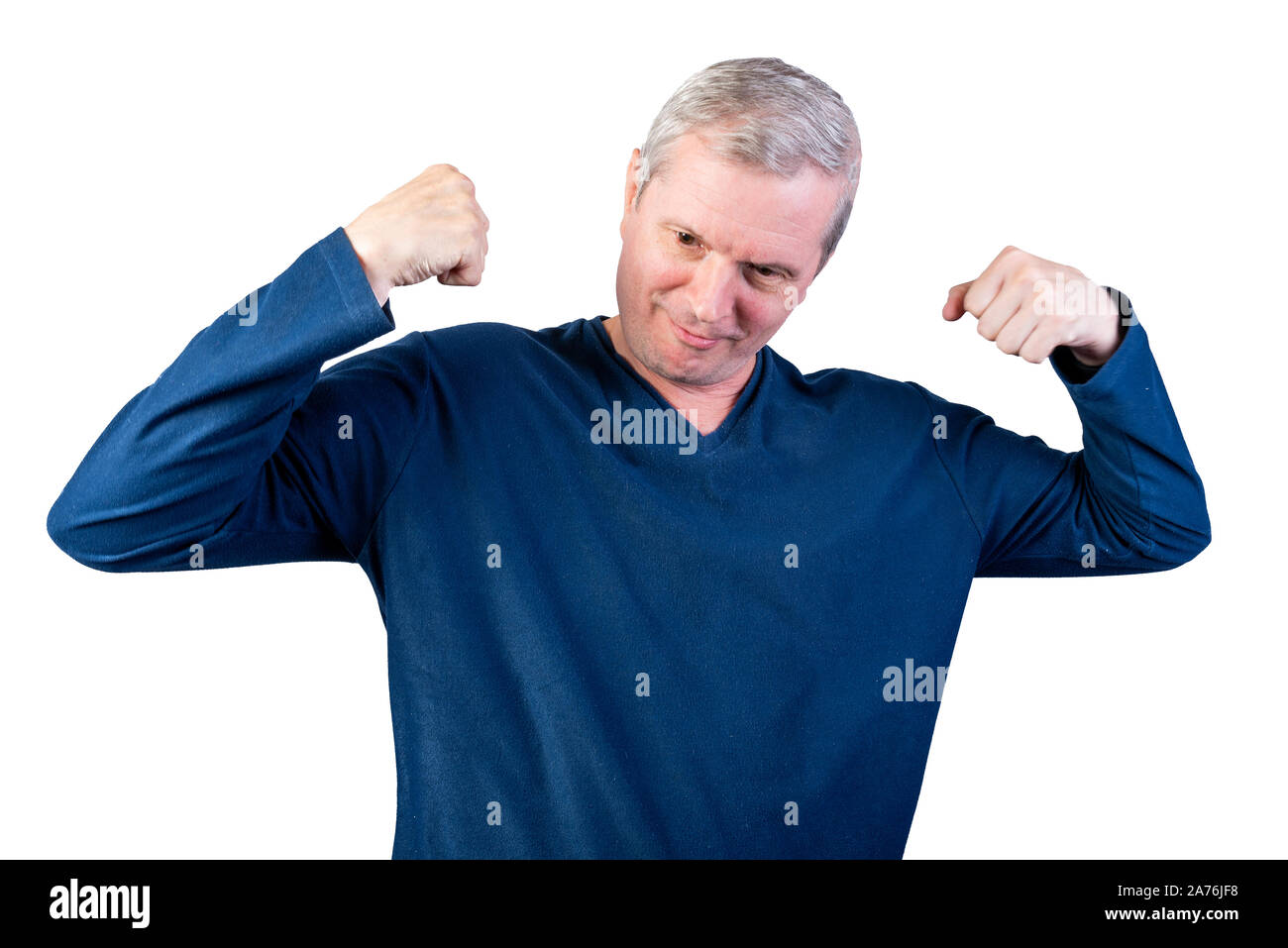 Elderly man shows strength. Isolated on a white background. Stock Photo
