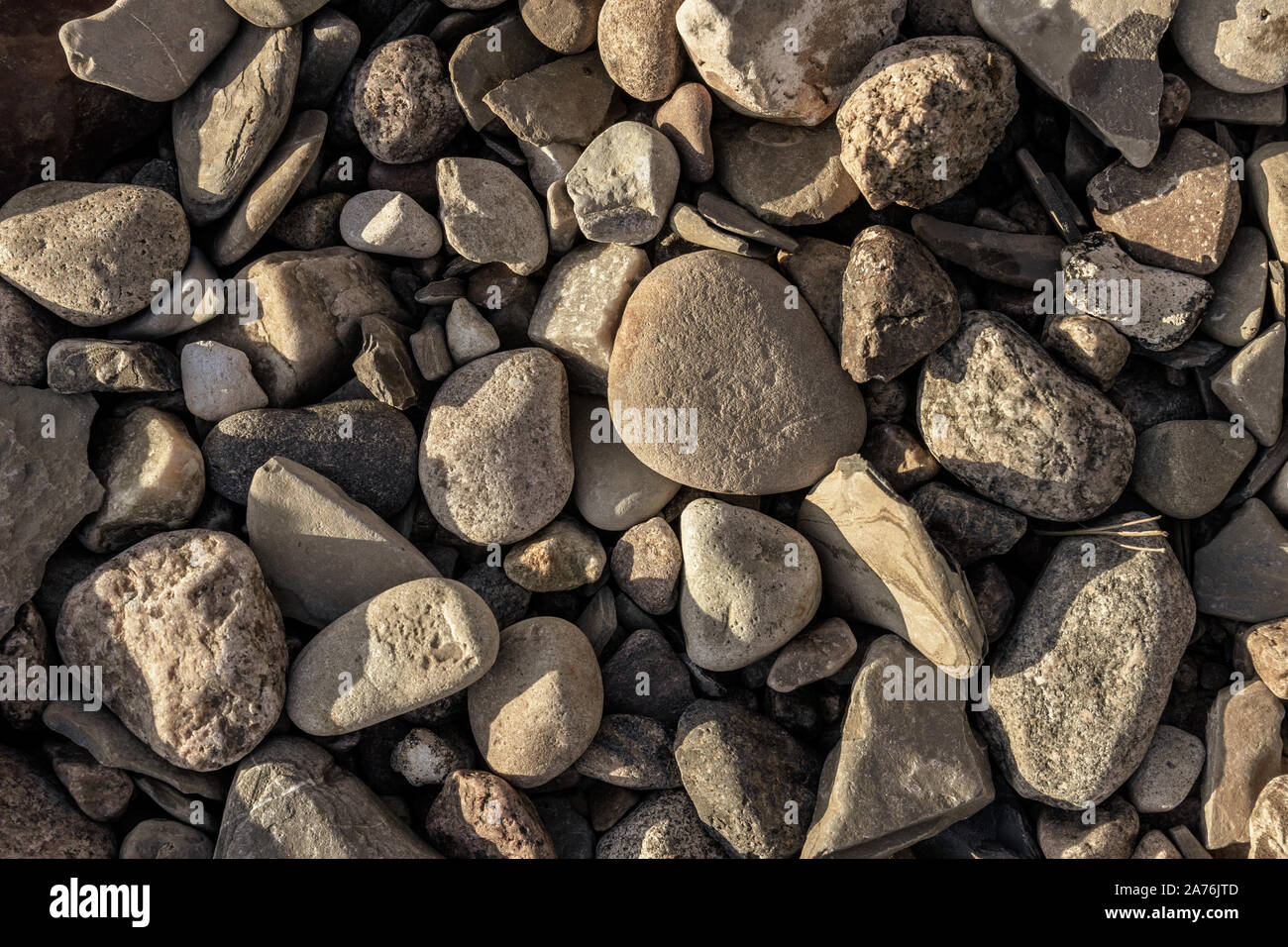 Vary Small Rocks Small stones in different shapes on the shore Stock Photo - Alamy