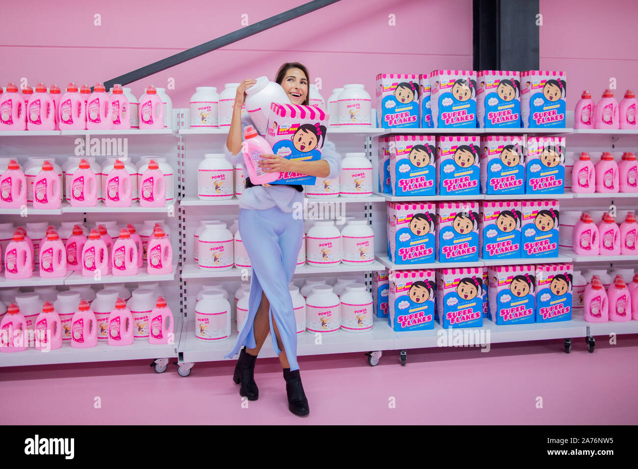 Cologne, Germany. 30th Oct, 2019. Malia Keana poses in a pink supermarket  setting in the "Supercandy Pop-Up" museum. On 1 November, the "Supercandy  Pop-Up" Museum opens in Cologne and offers photographers, bloggers