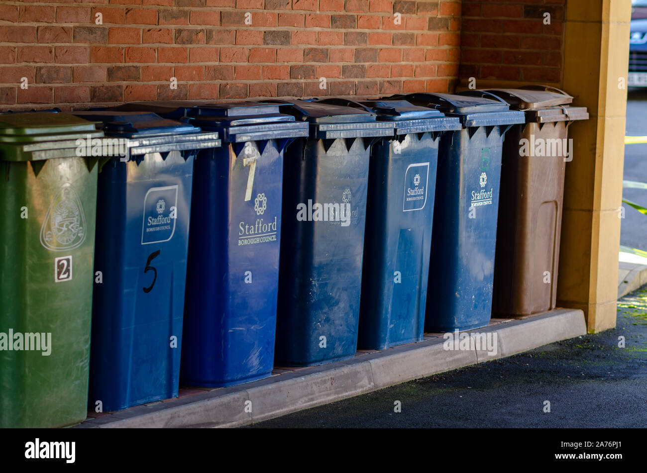 Stone, Staffordshire / United Kingdom - November 9 2019: Rubbish bins with Stafford Borough Council logo on it. The green for general waste, blue for Stock Photo