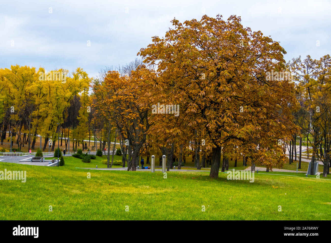 Scenic view of the city park with multicolored fall foliage in downtown Minsk, Belarus Stock Photo