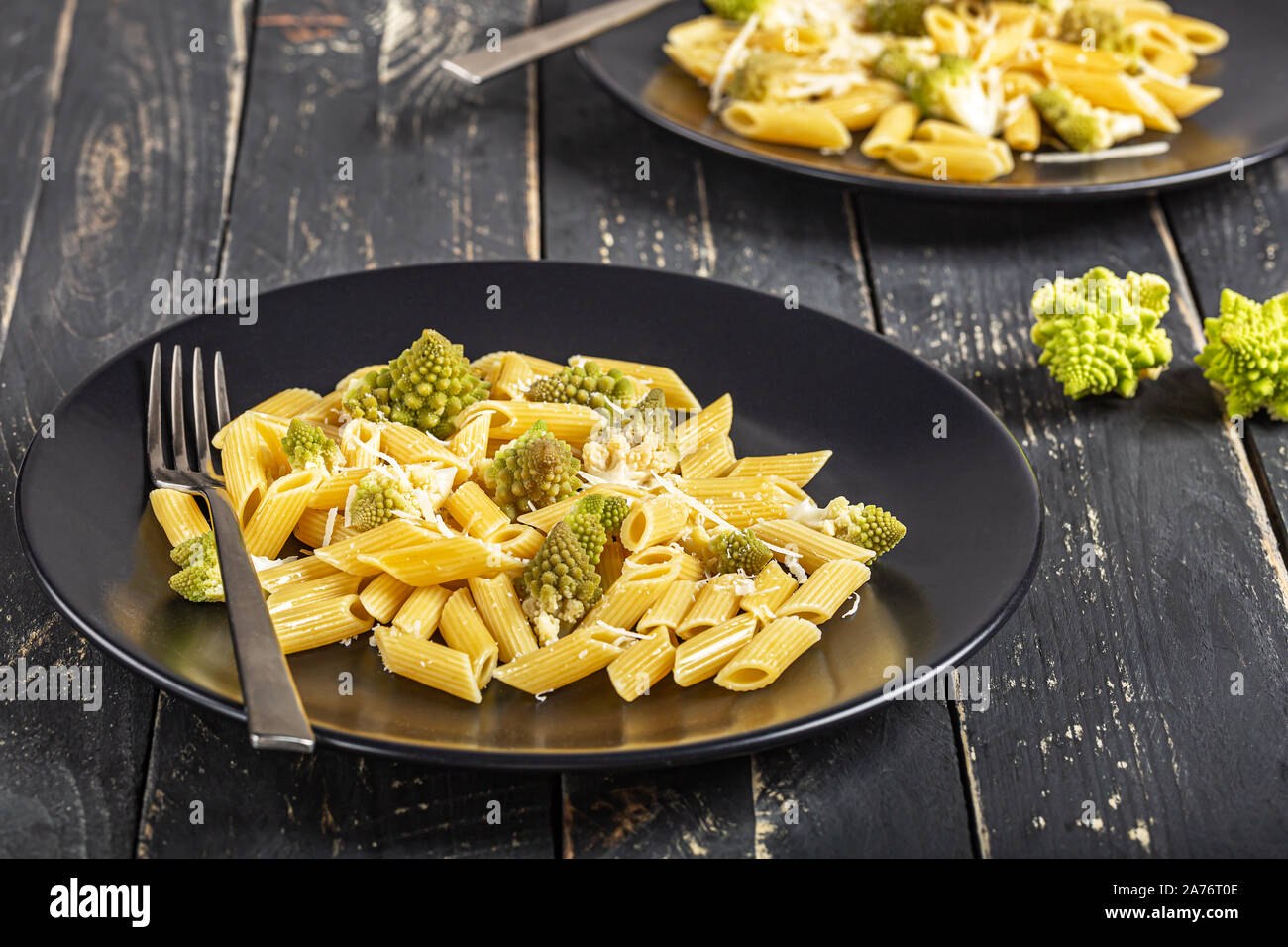 Penne pasta with romanesco cabbage on darck wooden background Stock Photo Alamy