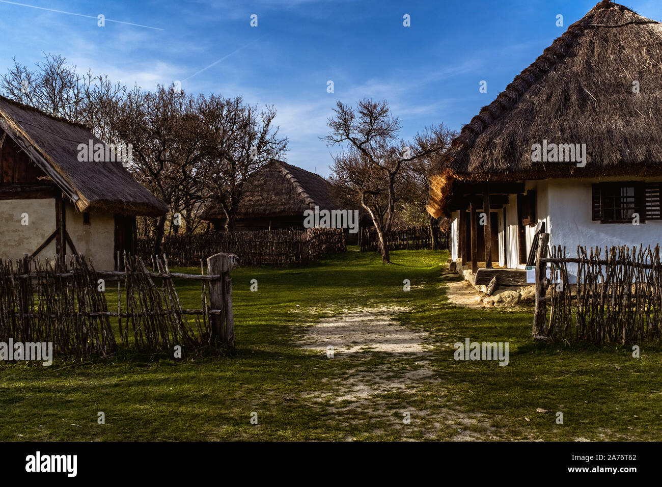 Traditional Hungarian farm yard in Szentendre Skanzen Village Museum on a sunny spring day. Stock Photo