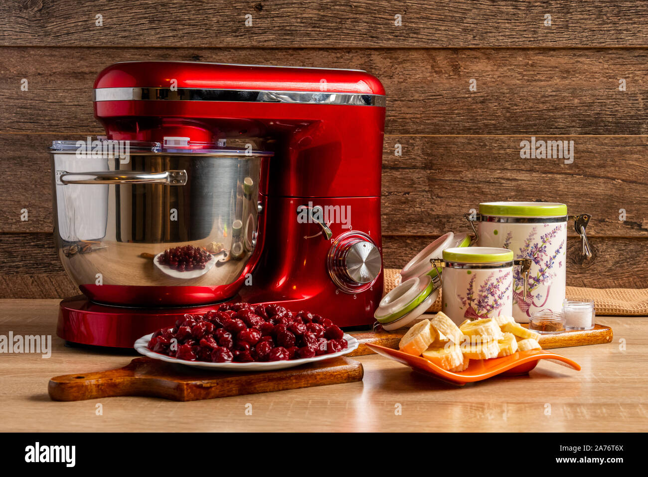 Stand mixer and ingredients for making muffin batter with sour cherries