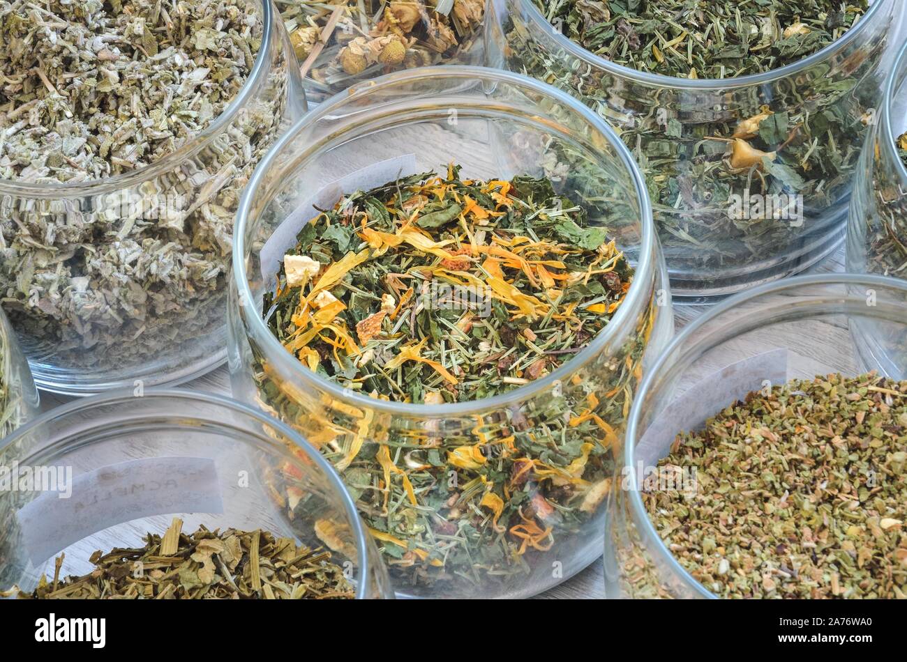 Set of various herbs. Herbal teas in jars on a wooden table. Stock Photo