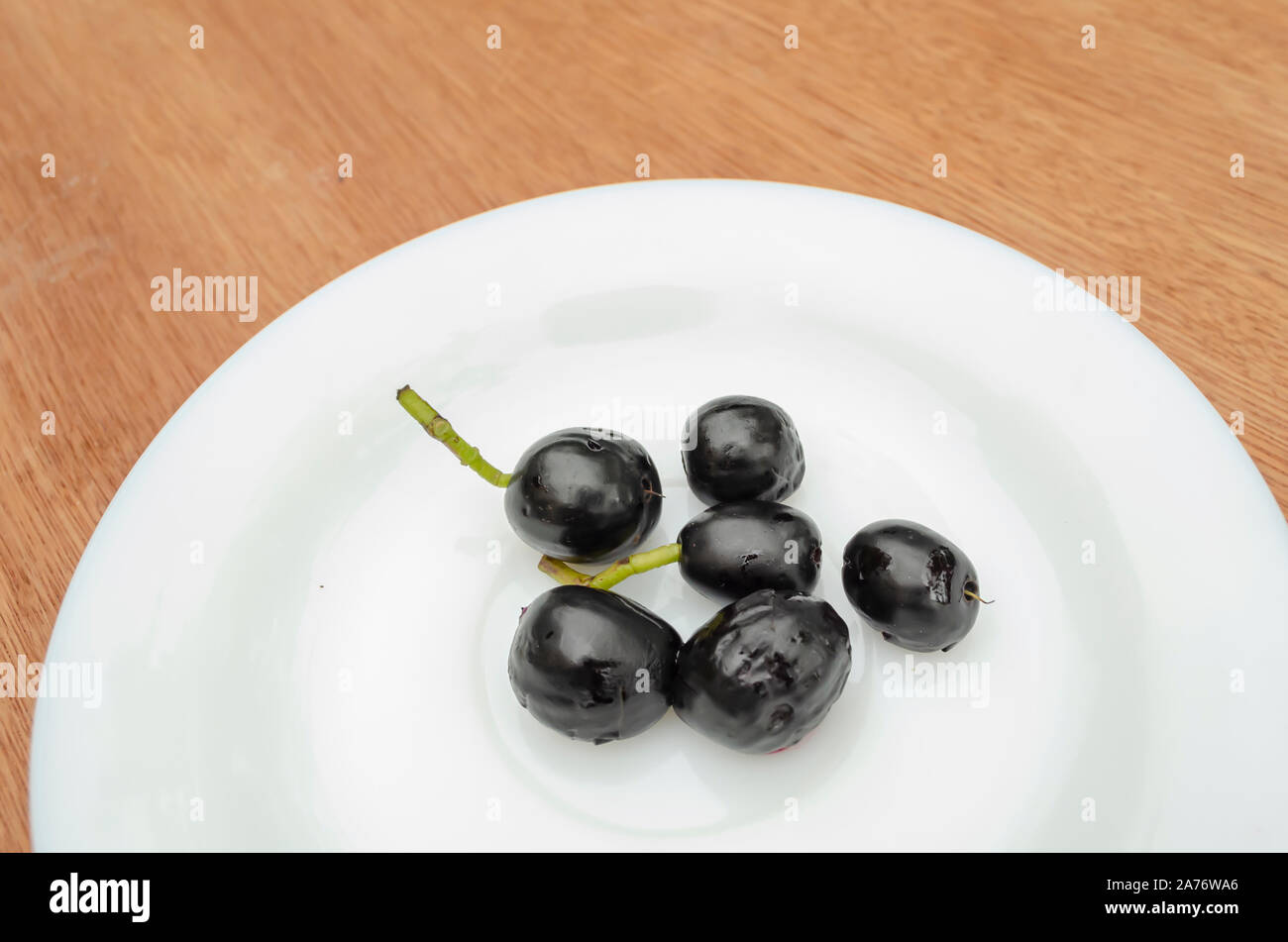 Indian Blueberry In Plate Stock Photo Alamy