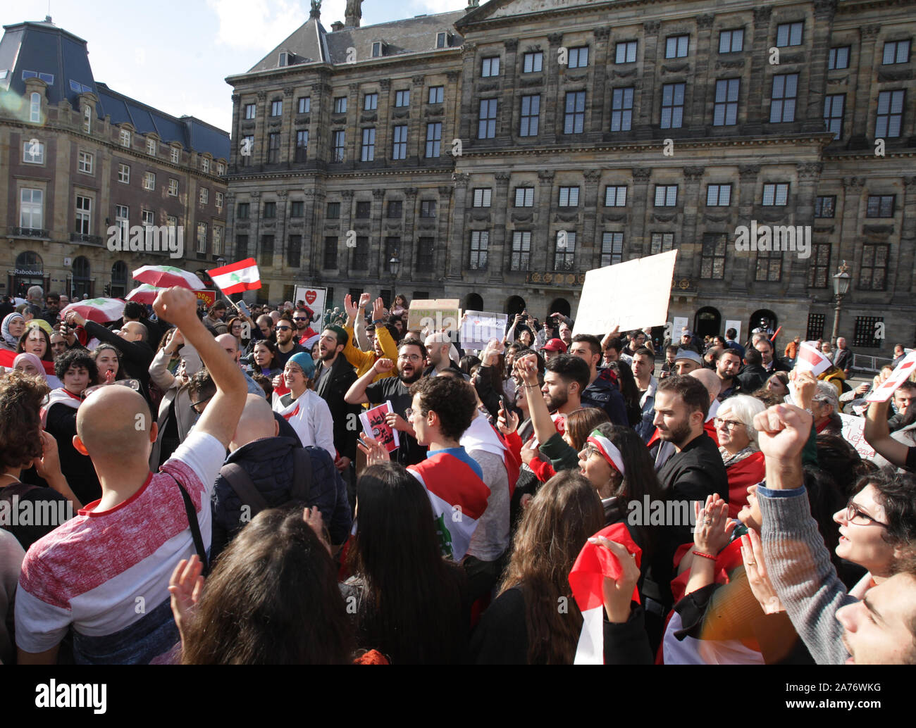 Members of the Lebanese community protesters chant slogans during an