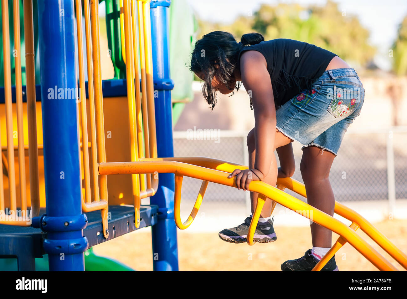 A girl climbing a ladder hires stock photography and images Alamy