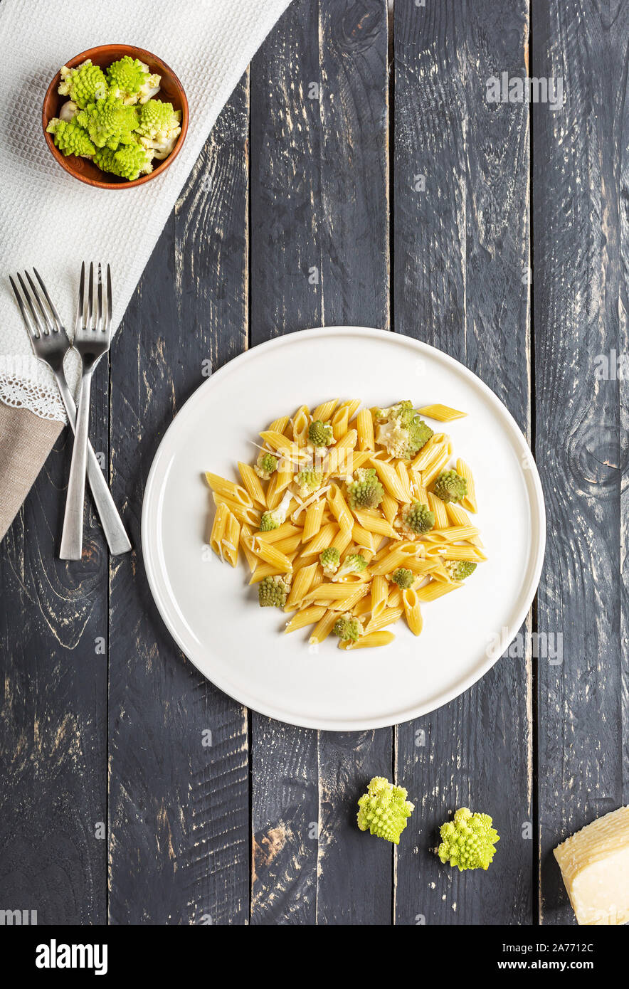 Penne pasta with romanesco cabbage on darck wooden background Stock Photo Alamy