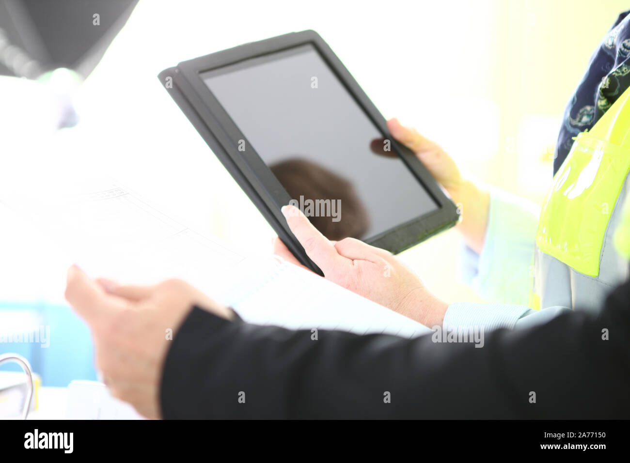 people at work with a table and papers Stock Photo