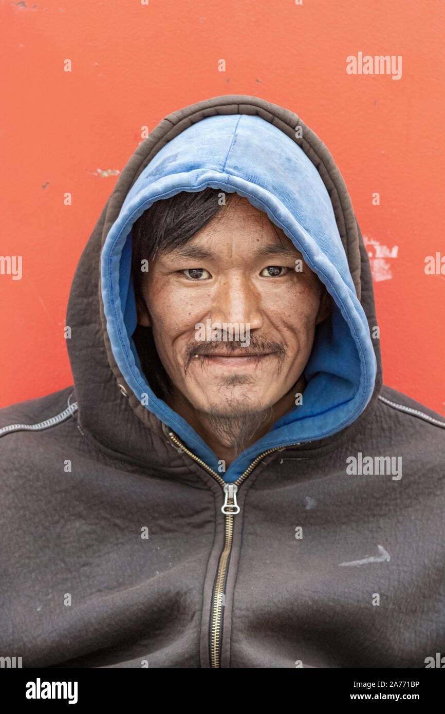 Portrait of an Inuit - eskimo local man looking camera in Nuuk. outdoors. Stock Photo