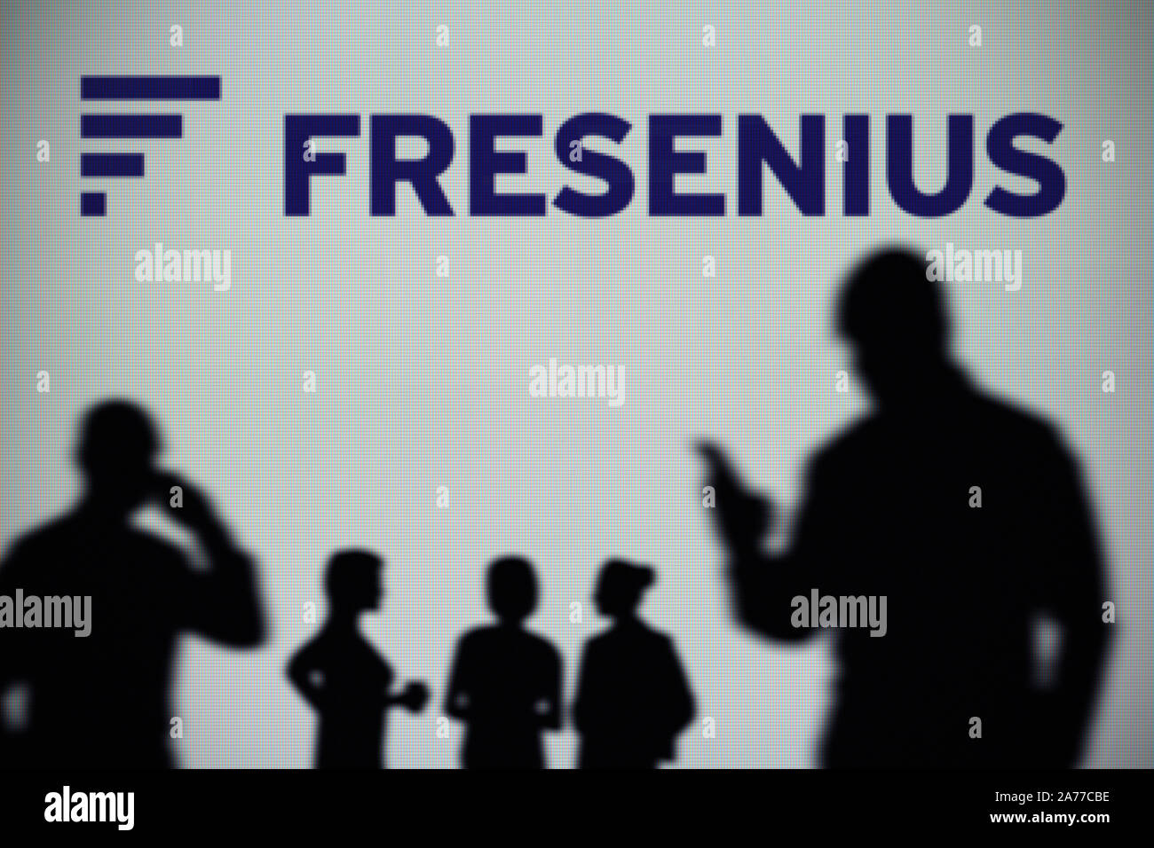 Fresenius company logo on a website with blurry stock market developments  in the background, seen on a computer screen through a magnifying glass  Stock Photo - Alamy