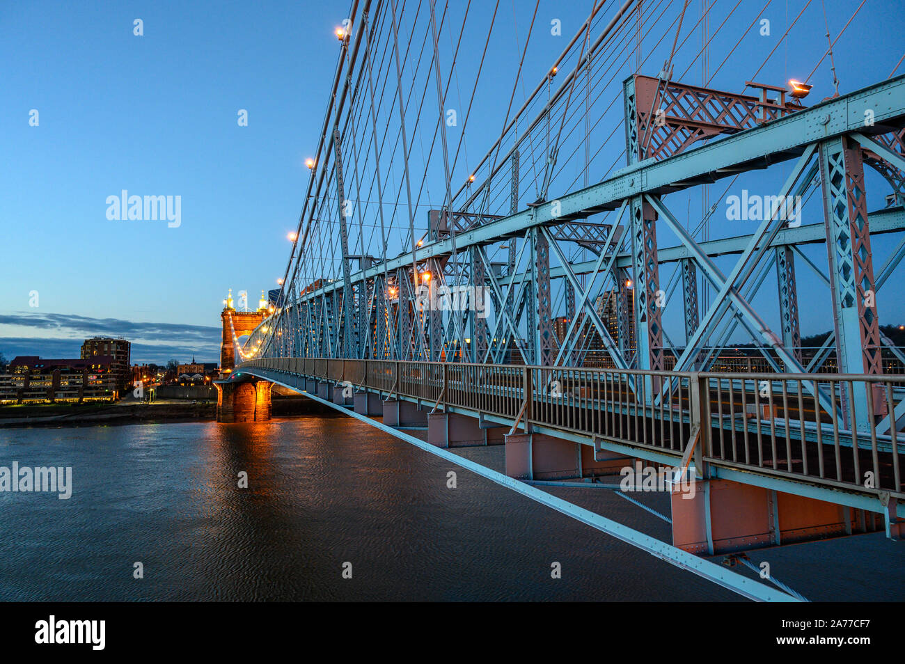 The John A. Roebling Suspension Bridge in Cincinnati, Ohio crosses the Ohio River between Cincinnati and Covington, Kentucky. Stock Photo