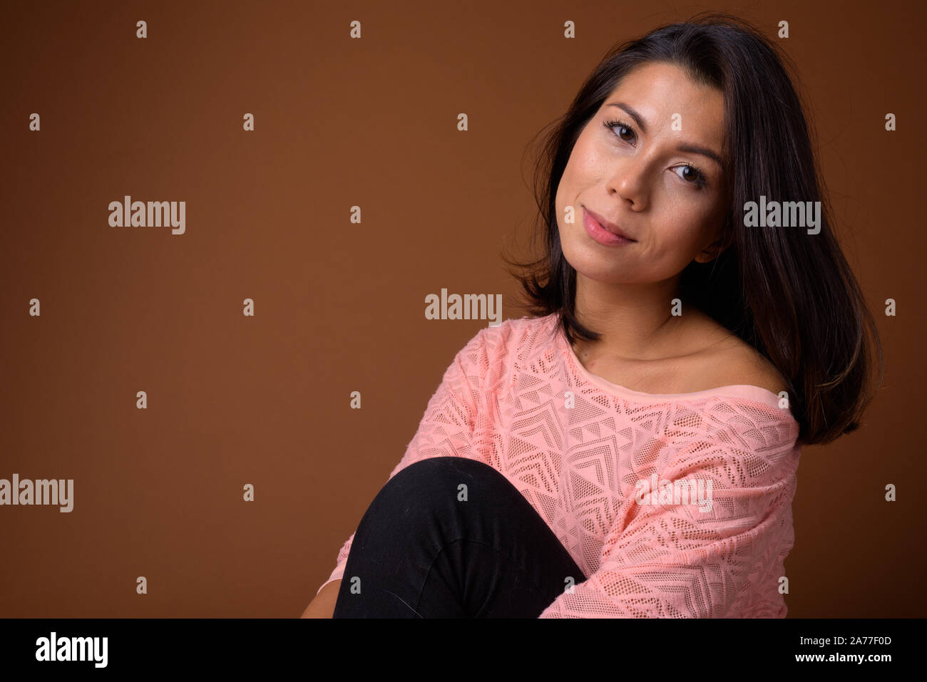 Mid adult woman sitting on floor hi-res stock photography and images ...