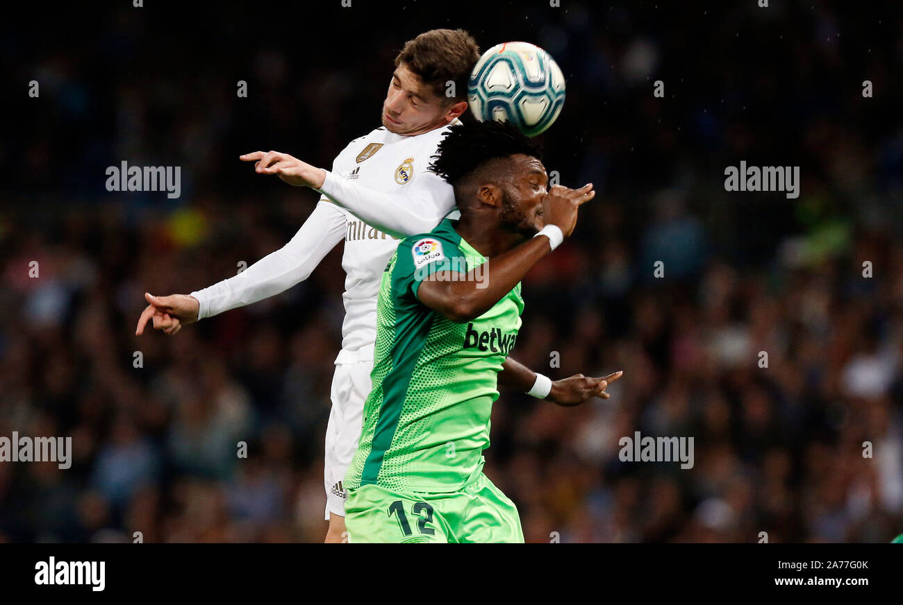 Madrid, Spain. 30th Oct, 2019. Real Madrid CF's Fede Valverde and CD Leganes's Chidozie Awaziem competes for the ball during the Spanish La Liga match round 11 between Real Madrid and CD Leganes at Santiago Bernabeu.(Final score: Real Madrid 5 - 0 Leganes) Credit: SOPA Images Limited/Alamy Live News Stock Photo