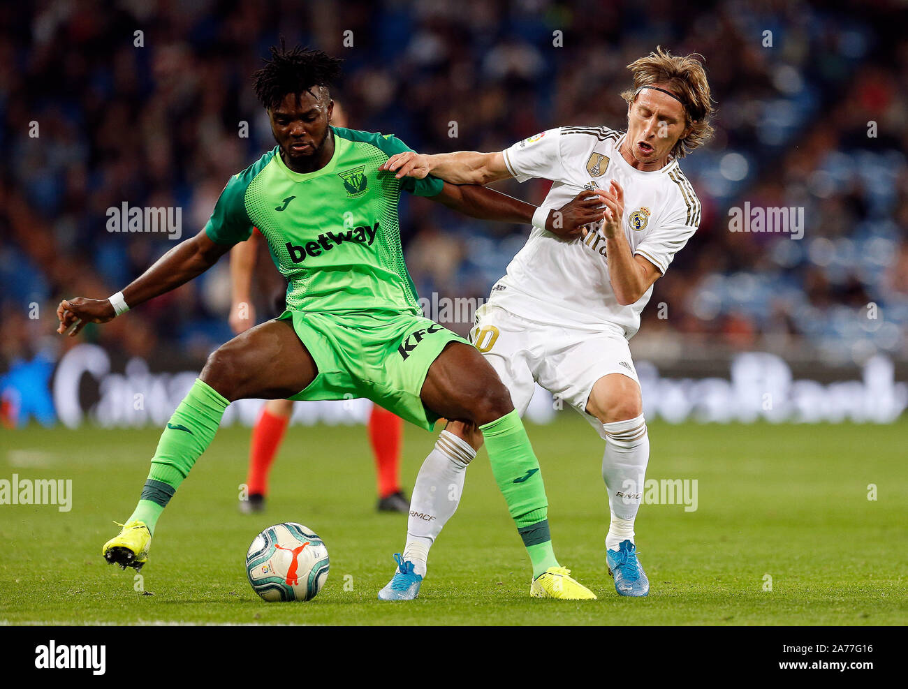 Madrid, Spain. 30th Oct, 2019. CD Leganes's Kenneth Omeruo and Real Madrid CF's Luka Modric competes for the ball during the Spanish La Liga match round 11 between Real Madrid and CD Leganes at Santiago Bernabeu Stadium.(Final score: Real Madrid 5 - 0 Leganes) Credit: SOPA Images Limited/Alamy Live News Stock Photo