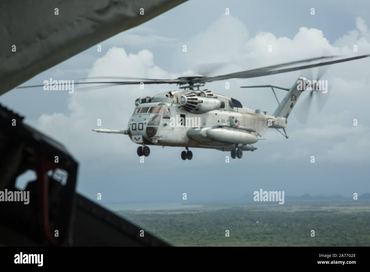 A CH-53E Super Stallion helicopter with Special Purpose Marine Air-Ground Task Force – Southern Command flies over Ladyville, Belize, Oct. 28, 2019. The task force will be conducting aerial refueling operations with KC-130J Hercules tanker aircraft with Marine Aerial Refueler Transport Squadron 234. The task force is conducting training and engineering projects hand-in-hand with partner nation military members in Latin America and the Caribbean during their deployment to the region, which coincides with hurricane season. (U.S. Marine Corps photo by Sgt. Stanley Moy) Stock Photo